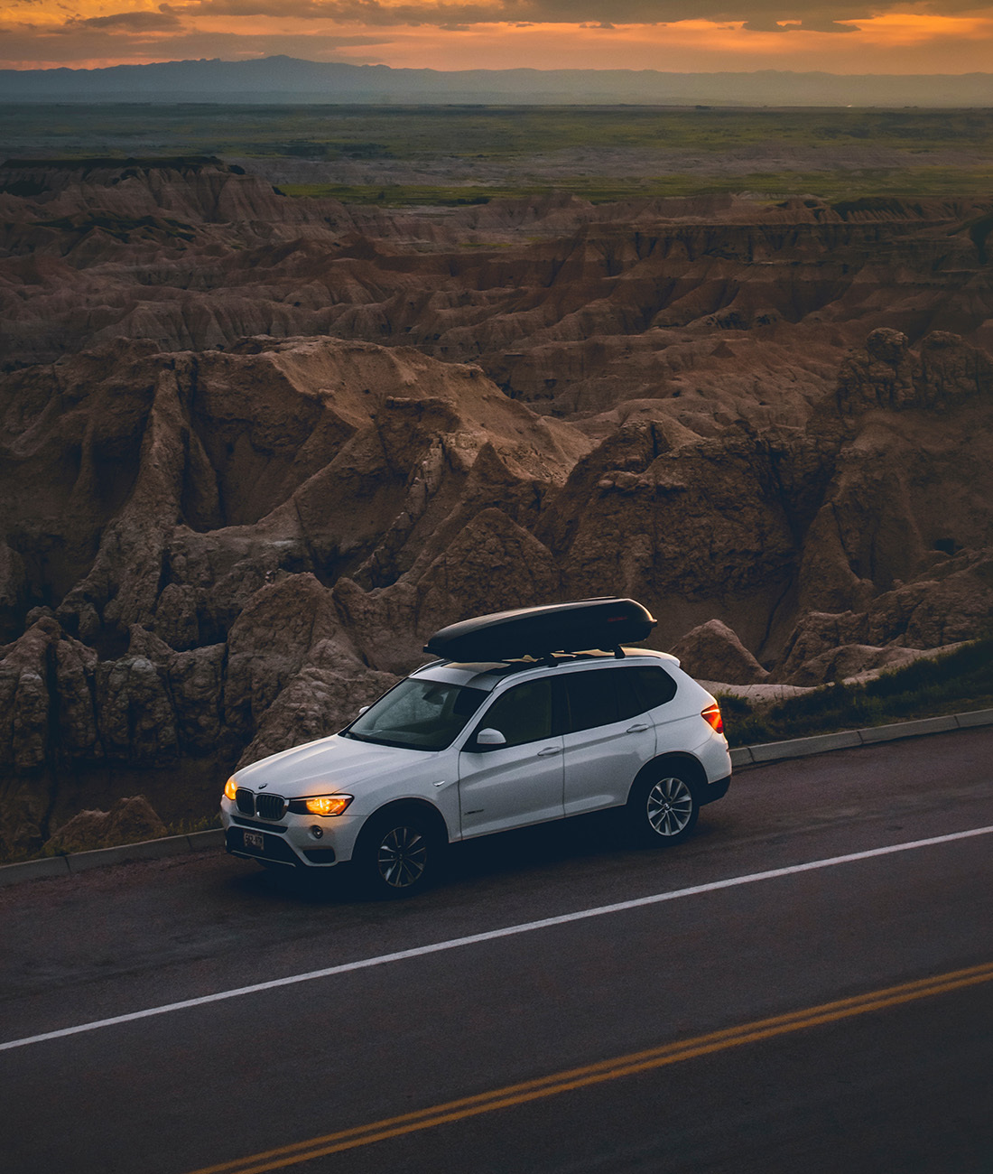 an SUV on the road in the desert